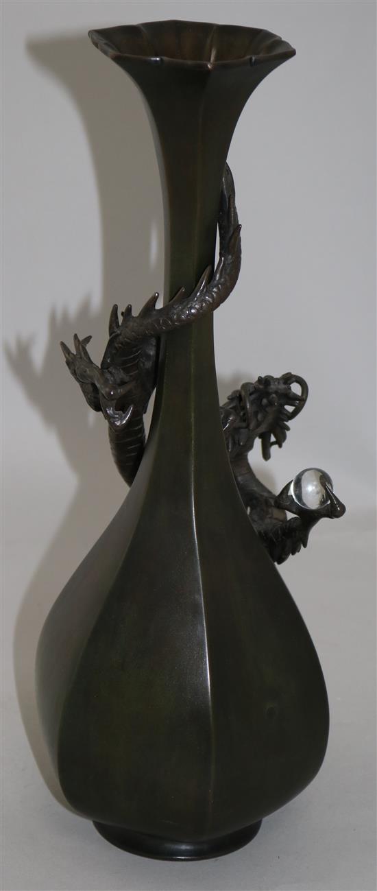 A Japanese bronze dragon hexagonal bottle vase, c.1880, 35.5cm